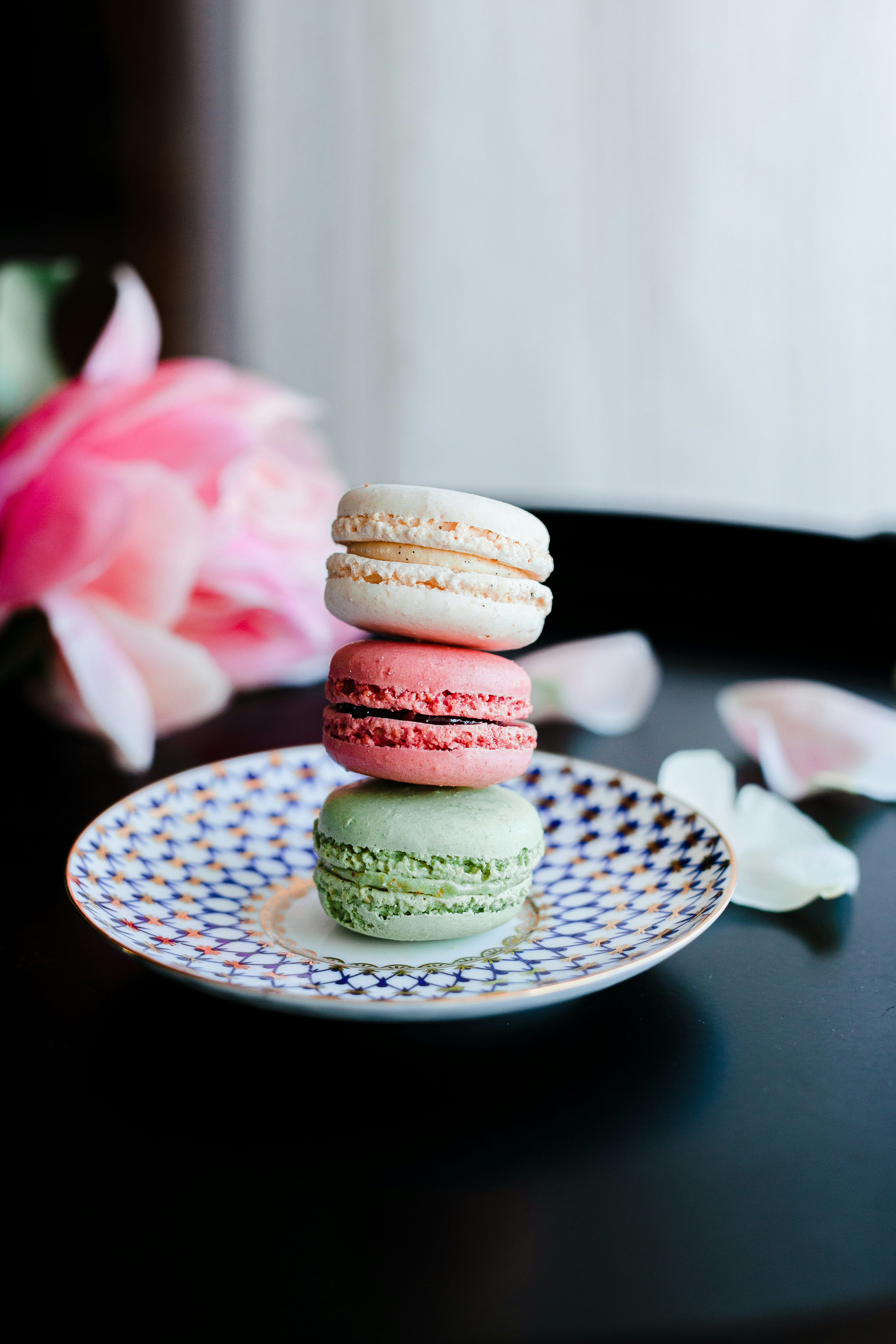 3 layered cookies on white ceramic plate